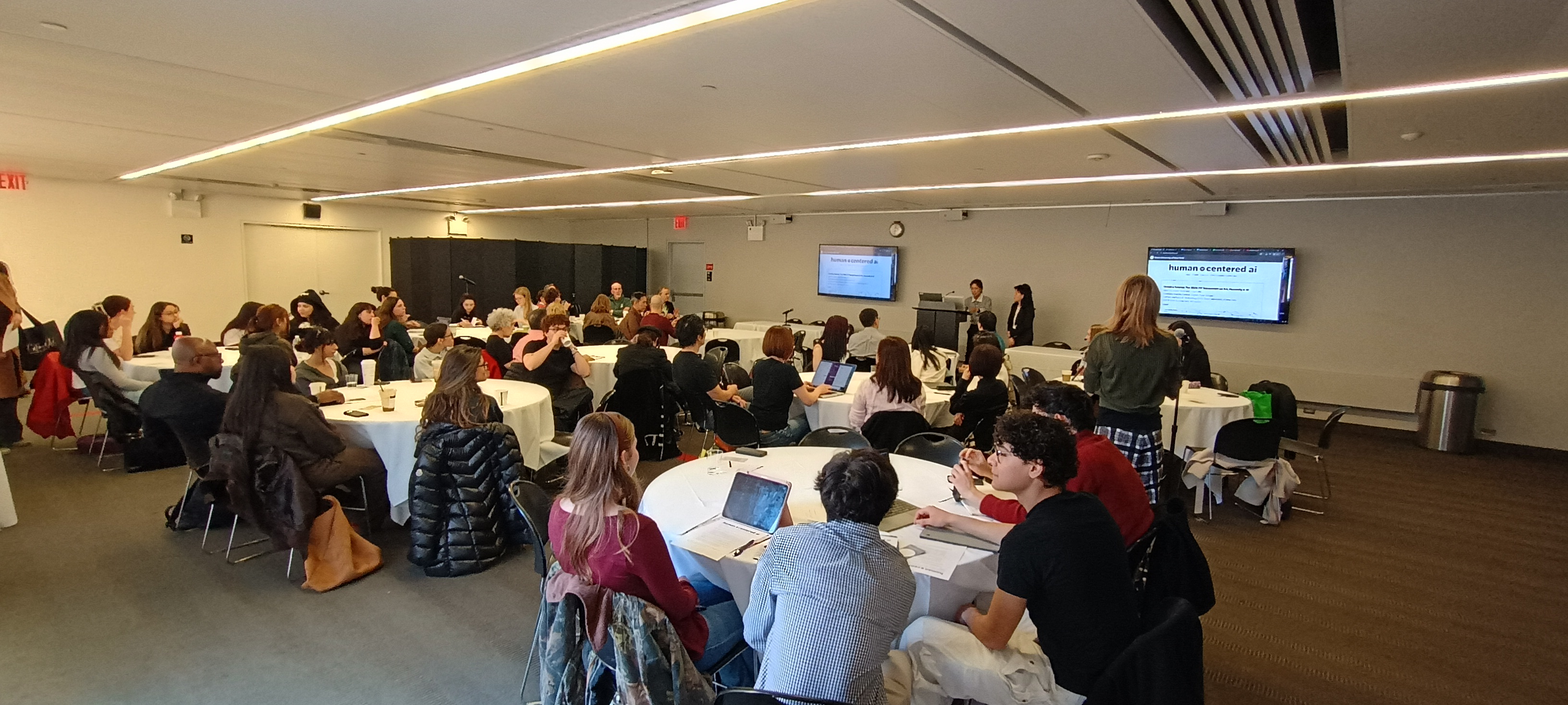 Attendees at symposium, Junghyun Ahn and Kyunghee Pyun Speaking